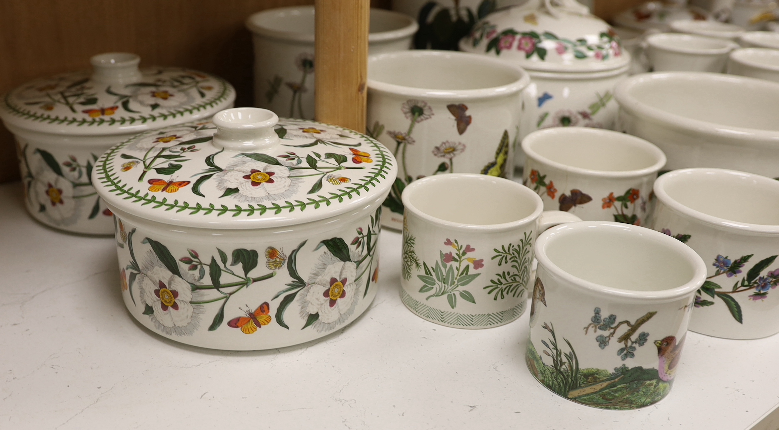 A Royal Worcester Evesham part dinner service, together with Portmeirion items including eight mugs, three lidded tureens, etc.